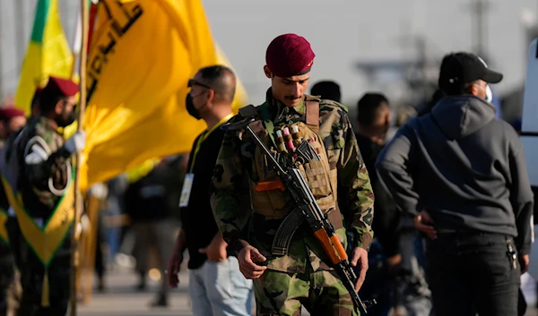 Fighters from the Popular Mobilization Forces attend the funeral of a Kataib Hezbollah commander, Abu Baqir Al-Saadi, who was martyred in a US airstrike, in Baghdad, Iraq, February 8, 2024 (AP)