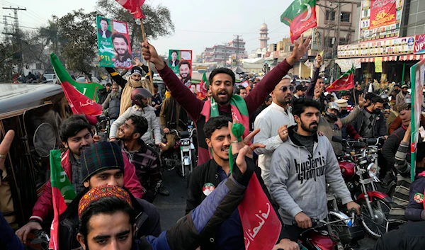 Supporters of former prime minister Imran Khan and political party Pakistan Tehreek-e-Insaf (PTI) attend an election campaign rally in Lahore, Pakistan, Sunday, Jan. 28, 2024(AP)