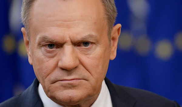 Poland's Prime Minister Donald Tusk listens to a question while talking to journalists as he arrives for an EU summit in Brussels, Thursday, Feb. 1, 2024.(AP)