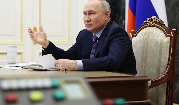 Russian President Vladimir Putin gestures while speaking at a meeting of the Presidential Council for Science and Education via videoconference at the Kremlin in Moscow, Russia, Thursday, Feb. 8, 2024. (AP)