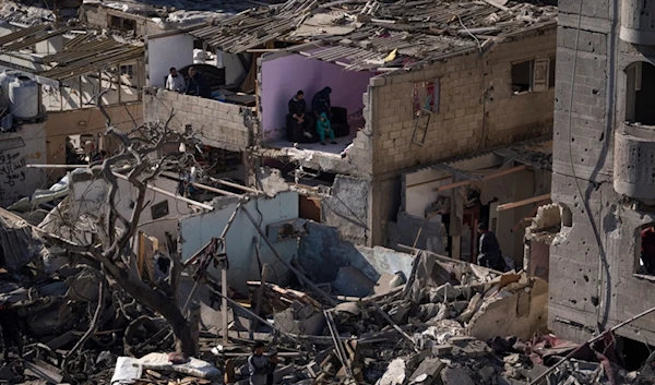 Palestinians look at the destruction after an Israeli strike on residential buildings and a mosque in Rafah, Gaza Strip, Thursday, Feb. 22, 2024. (AP)