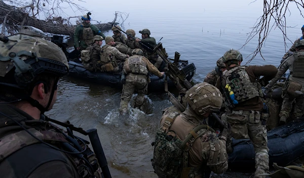 Ukrainian troops board a boat on the shore of Dnieper River near Kherson on Sunday Oct. 15, 2023.  (AP)