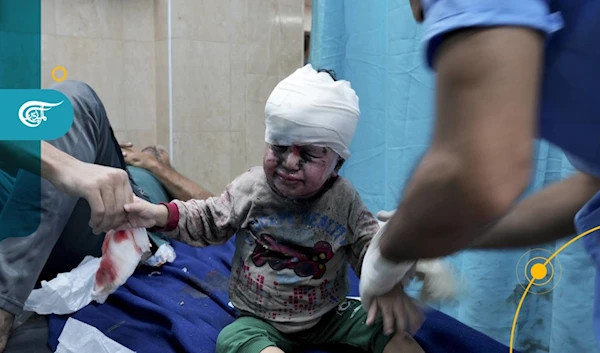 A child is given treatment in a Gaza hospital after being injured in an Israeli airstrike. (Al Mayadeen Net)