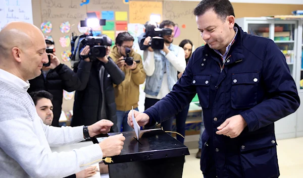 Luis Montenegro, leader of the center-right Democratic Alliance coalition, casts his ballot at a poling station in Espinho, northern Portugal, Sunday, March 10, 2024. (AP)