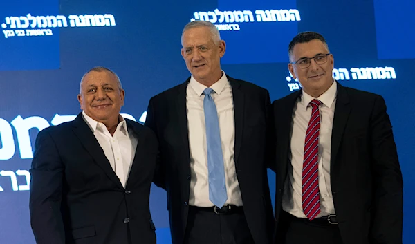 Former IOF chief Gadi Eisenkot, left, Benny Gantz, center, and Gideon Sa'ar pose together in 'Ramat Gan', occupied Palestine, August 14, 2022 (AP)