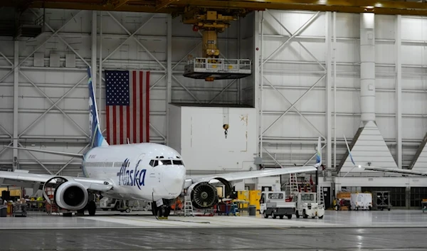 An Alaska Airlines aircraft sits in the airline's hangar at Seattle-Tacoma International Airport Wednesday, Jan. 10, 2024, in SeaTac, Wash. (AP Photo/Lindsey Wasson)