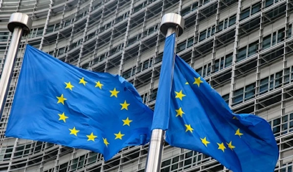 European Union flags fly outside the headquarters of the European Commission in Brussels. (AFP)