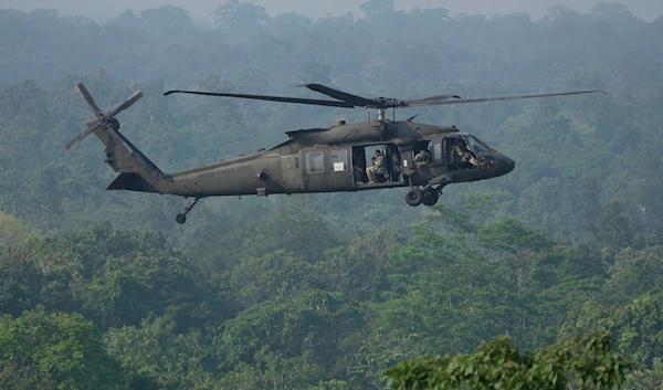 A U.S. Army Blackhawk helicopter flies past during Super Garuda Shield 2022 joint military exercises in Baturaja, Indonesia, Friday, Aug. 12, 2022. (AP)