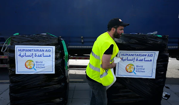 A member of the World Central Kitchen prepares a pallet with the humanitarian aid at a warehouse near Larnaca, Cyprus, on Wednesday, March 13, 2024 (AP)