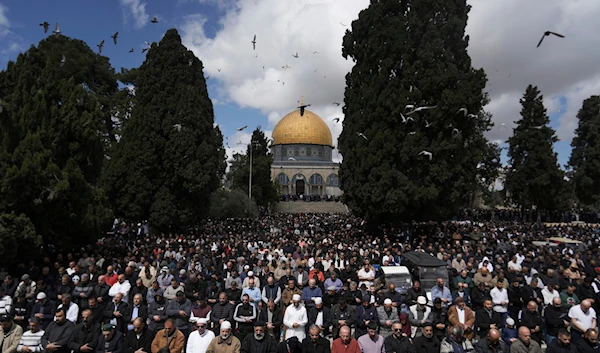 Muslim worshippers perform Jummuah, or Friday, prayers at the al-Aqsa Mosque compound in the Old City of al-Quds during the holy month of Ramadan, March 15, 2024 (AP)