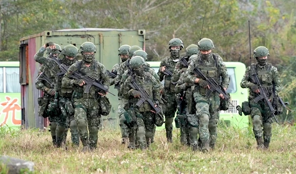 Taiwanese soldiers take part in drills at the Army defense command base in Taitung in southern Taiwan on Wednesday, Jan. 31, 2024. (AP)