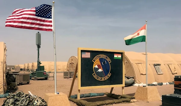 US and Niger flags are raised side by side at the base camp for air forces and other personnel supporting the construction of Niger Air Base 201 in Agadez, Niger in April 2018. (AP)