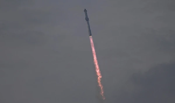 SpaceX's mega rocket Starship cuts through clouds and haze on it's third test flight from Starbase in Boca Chica, Texas, Thursday, March 14, 2024. (AP Photo/Eric Gay)