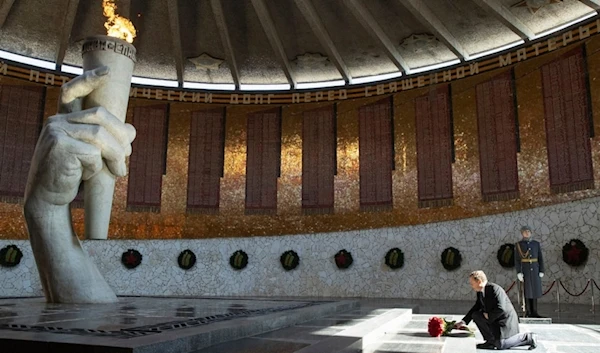 Russian Security Council Deputy Chairman and the head of the United Russia party Dmitry Medvedev lays flowers inside the monument to Motherland, in Volgograd, Russia, on Tuesday, March 12, 2024. (AP)