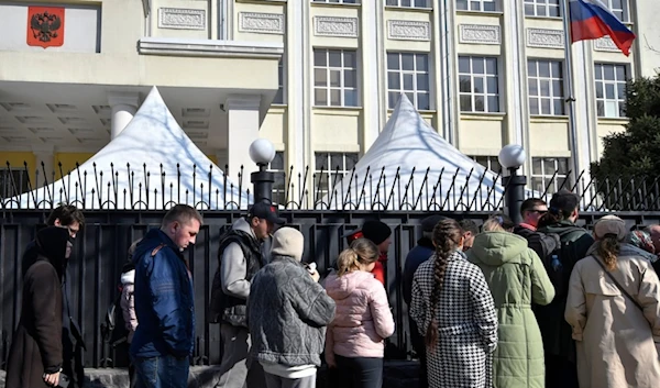 Voters queue outside the Russian Embassy in Bishkek, Kyrgyzstan, Sunday, March 17, 2024. (AP)