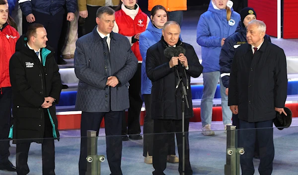 Russian President Vladimir Putin, 2nd right, attends a concert marking his victory in a presidential election in Moscow, Russia, Monday, March 18, 2024.(AP)