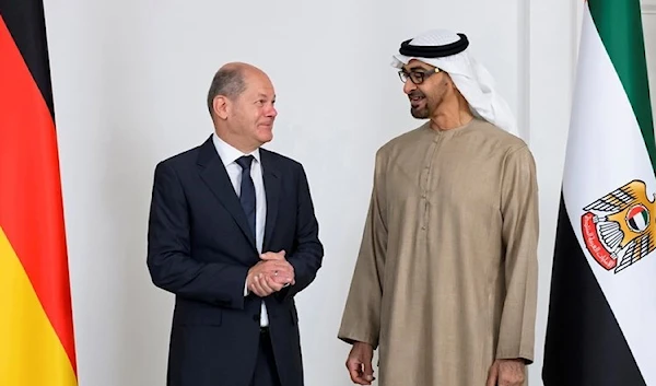 Mohamed bin Zayed Al Nahyan, President of the UAE right and German Chancellor Olaf Scholaz, talk prior to a meeting at Al Shati palace in Abu Dhabi, UAE , September 25,2022. (AP)