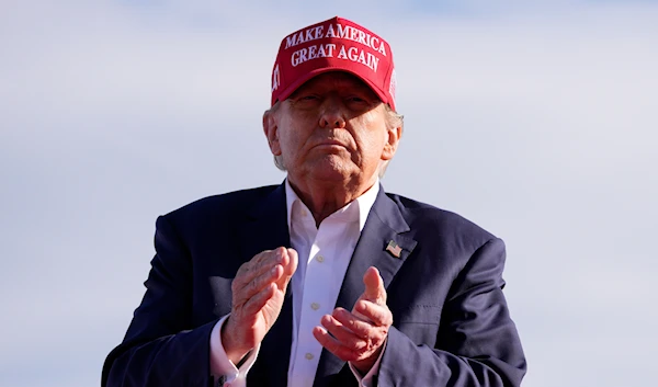 Republican presidential candidate and former President Donald Trump applauds at a campaign rally Saturday, March 16, 2024, in Vandalia, Ohio. (AP)