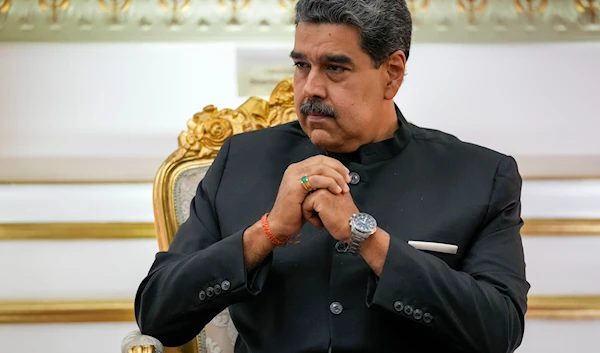 Venezuelan President Nicolas Maduro listens to Russia's Foreign Minister Sergey Lavrov during their meeting at Miraflores presidential palace in Caracas, Venezuela, Tuesday, Feb. 20, 2024. (AP)