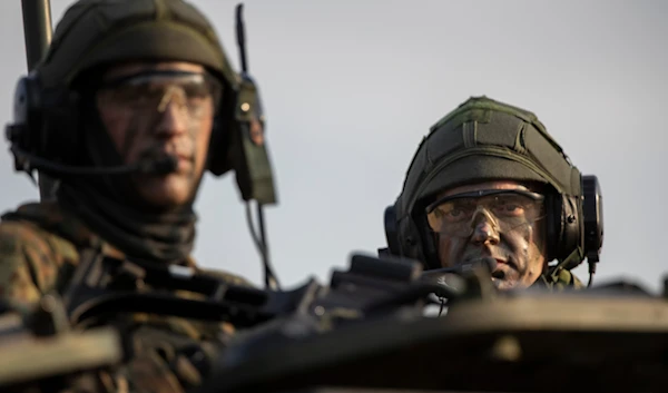 Soldiers of the German Bundeswehr 41st Mechanized Infantry Brigade take part in a military exercise at the Gaiziunai training ground some 130 km west of the capital Vilnius, Lithuania, on October 8, 2022 (AP)