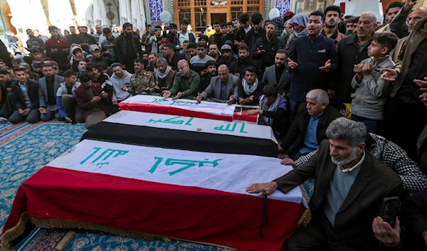 Iraqis attend the funeral of Popular Mobilization Forces fighters killed in the U.S. airstrikes at the Imam Ali shrine in Najaf, Iraq, Sunday, Feb. 4, 2024. (AP)