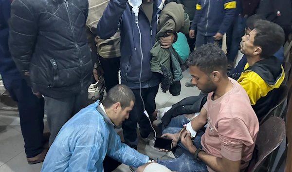 Palestinians wounded in an Israeli strike while waiting for humanitarian aid on the beach in Gaza City are treated in al-Shifa Hospital on Thursday, Feb. 29, 2024. (AP)