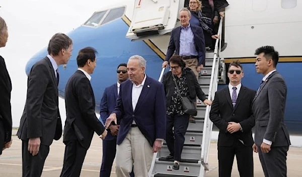 US Senate Majority Leader Chuck Schumer center and other members of the delegation arrive at Shanghai Pudong International Airport in Shanghai, China, Saturday, Oct.7, 2023. (AP)