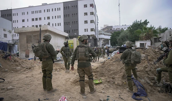 IOF troops surround Al-Shifa Hospital in Gaza City, Wednesday, Nov. 22, 2023.(AP)