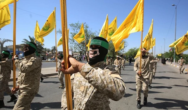 Iraqi al-Nujaba Resistance movement members march during a military parade marking Al-Quds International Day in Baghdad, May 31, 2019. (AFP)