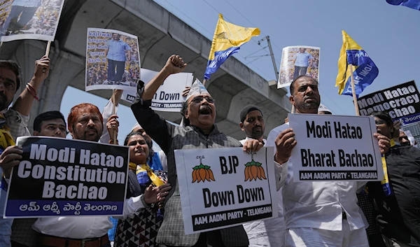 Supporters of Aam Admi Party, hold placards and shout slogans during a protest against the arrest of their party leader Arvind Kejriwal, in Hyderabad, India, Friday, March 22, 2024.(AP)