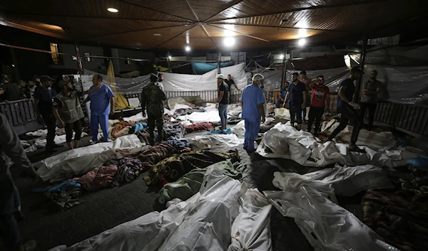 Bodies of Palestinians killed by IOF bombing Al-Ahli Arab Hospital are gathered in the front yard of the al-Shifa hospital, in Gaza City, central Gaza Strip, Tuesday, Oct. 17, 2023. (AP)