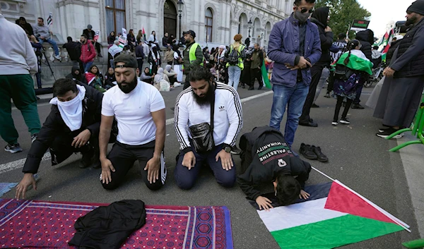 Protesters pray during a pro-Palestinian demonstration in London, Saturday, Oct. 14, 2023.(AP)