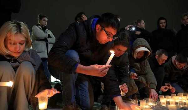 People light candles in memory of the victims of the terrorist attack in Moscow, in the center of in the center of Simferopol, in Crimea, Friday, March 22, 2024.(AP)