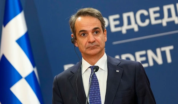 Greece's Prime Minister Kyriakos Mitsotakis attends a joint press conference with Serbian President Aleksandar Vucic in Belgrade, Serbia, Monday, Feb. 12, 2024. (AP Photo/Darko Vojinovic)