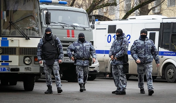 Police officers walk near the Basmanny District Court in Moscow, Russia, Sunday, March 24, 2024. (AP)