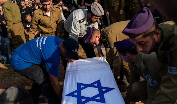 Israeli occupation troops lower the coffin of Israeli Staff Sergeant Shay Arvas at a cemetery outskirts of 'Tel Aviv', occupied Palestine, Thursday, Nov. 2, 2023.(AP)