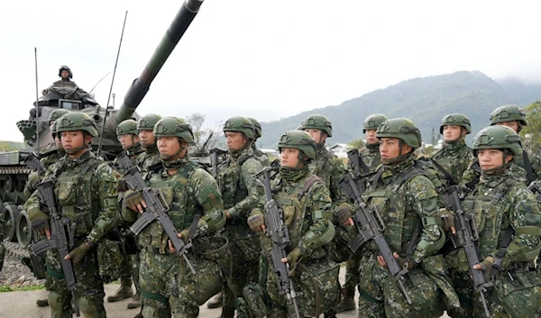 Taiwanese soldiers take part in drills at the Army defense command base in Taitung in southern Taiwan on Wednesday, Jan. 31, 2024. (AP)