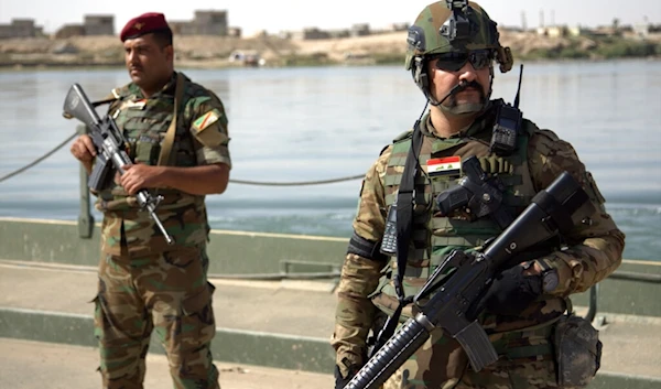 n this Saturday, Oct. 15, 2016 file photo, Iraqi soldiers secure a temporary pontoon bridge near Qayara Air Base, northern Iraq (AP)