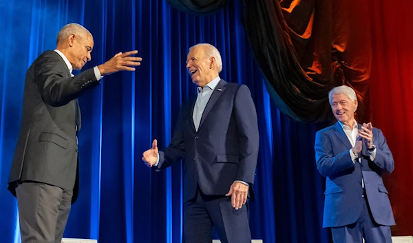 President Joe Biden, center, and former presidents Barack Obama and Bill Clinton participate in a fundraising event with Stephen Colbert at Radio City Music Hall,, March 28, 2024, in New York. (AP)