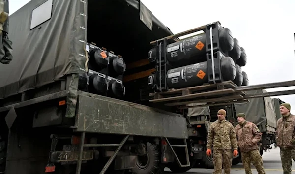 Ukrainian soldiers load a truck with a US-made FGM-148 Javelin anti-tank missile on its delivery at Kiev's Boryspil Airport on Feb. 11. (AFP via  Getty Images)