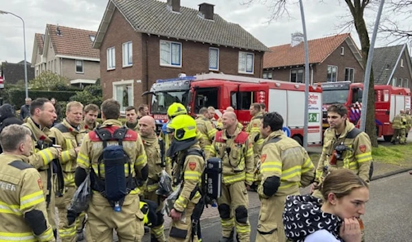 Firefighters gather in Eden, Netherlands, Saturday, March 30, 2024. Heavily armed police have cordoned off part of a Dutch town and say that multiple people are being held hostage in a building there. (AP)