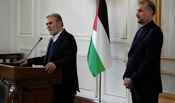 The leader of the Palestinian Islamic Jihad, Ziyad al-Nakhaleh, briefs the media after his meeting with the Iranian Foreign Minister Hossein Amir-Abdollahian, right, in Tehran, Iran, Saturday, March 30, 2024 (AP)