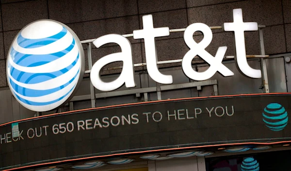 In this Monday, Oct. 24, 2016, file photo, the AT&T logo is positioned above one of its retail stores, in New York. (AP)