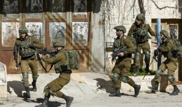 Illustrative: Israeli occupation soldiers shooting at Palestinians, in Bethlehem on February 6, 2020. (AFP)