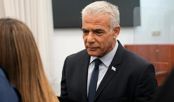 Israeli opposition leader Yair Lapid arrives to testify at the trial of the Israeli occupation Prime Minister Benjamin Netanyahu on corruption charges, in occupied al-Quds, Palestine June 12, 2023. (AP)