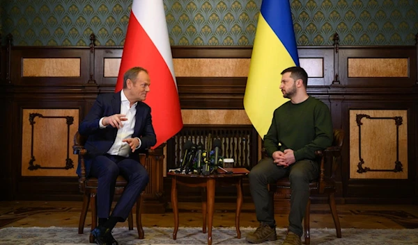 Poland's Prime Minister Donald Tusk, left, and Ukrainian President Volodymyr Zelensky talk during their meeting in Kiev, Ukraine, Monday, Jan. 22, 2024. (AP)