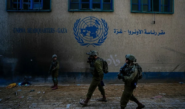 Israeli soldiers take position as they enter the UNRWA headquarter in Gaza, Thursday, Feb. 8, 2024. (AP)