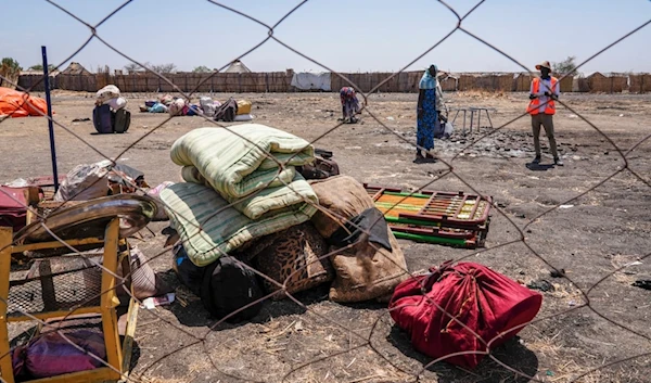 The belongings of people who crossed the border from Sudan sit in a yard at the Joda border crossing in South Sudan Tuesday, May 16, 2023 (AP)