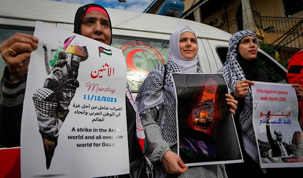 Palestinian women at a rally by pro-Palestinian activists to demand a ceasefire in Gaza, at Bourj al-Barajneh Palestinian refugee camp in Beirut, Lebanon, Dec. 11, 2023. (AP)