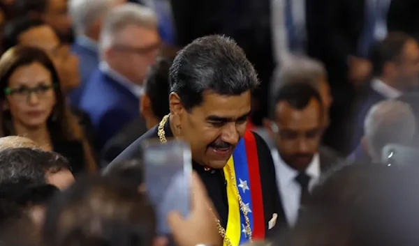 Venezuelan President Nicolas Maduro greets attendees upon his arrival at the Supreme Court of Justice building for the inauguration ceremony of the judicial year in Caracas on Jan. 31. (AFP via Getty Images)